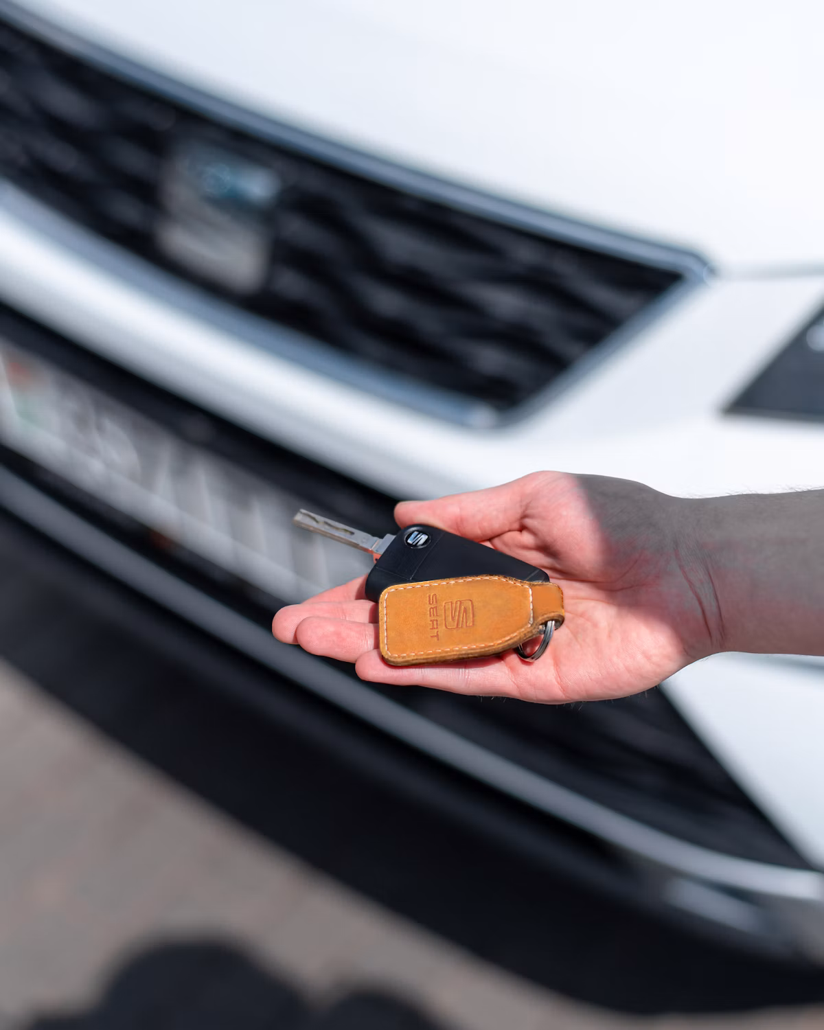 Person holding car keys after choosing a plan